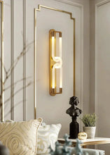 Load image into Gallery viewer, Inspira Lifestyles | Figaro Wall Sconce – Sculptural LED wall light with interlocking link design in brushed gold or matte black for modern and classic interiors
