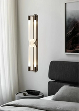 Load image into Gallery viewer, Inspira Lifestyles | Figaro Wall Sconce – Sculptural LED wall light with interlocking link design in brushed gold or matte black for modern and classic interiors

