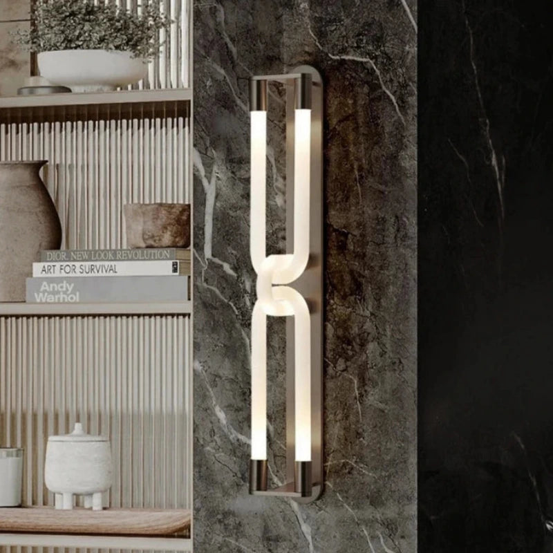 Inspira Lifestyles | Figaro Wall Sconce – Sculptural LED wall light with interlocking link design in brushed gold or matte black for modern and classic interiors