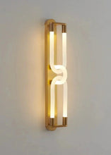 Load image into Gallery viewer, Inspira Lifestyles | Figaro Wall Sconce – Sculptural LED wall light with interlocking link design in brushed gold or matte black for modern and classic interiors
