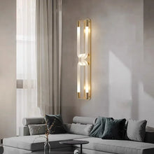 Load image into Gallery viewer, Inspira Lifestyles | Figaro Wall Sconce – Sculptural LED wall light with interlocking link design in brushed gold or matte black for modern and classic interiors
