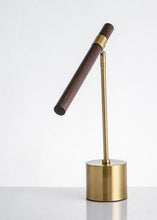 Load image into Gallery viewer, INSPIRA LIFESTYLES – Postaro Table Lamp – modern LED table lamp with postmodern design, featuring a dark wood base and satin brass accents. Sculptural yet functional lighting with a 90-degree adjustable tilt, perfect for bedside tables, home offices, and contemporary workspaces.
