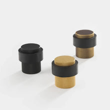 Load image into Gallery viewer, INSPIRA LIFESTYLES - Knurled Floor Door Stops featuring a crisscross diamond knurled pattern and protective rubber bumpers in Matte Black, Satin Brass and Antique Bronze.
