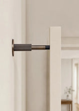 Load image into Gallery viewer, INSPIRA LIFESTYLES - Knurled Wall Door Stops with crisscross diamond-pattern detailing, adjustable length and rubber cushion pads in Matte Black, Satin Brass, Bright Chrome and Antique Bronze.
