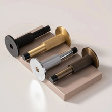 Load image into Gallery viewer, INSPIRA LIFESTYLES - Knurled Wall Door Stops with crisscross diamond-pattern detailing, adjustable length and rubber cushion pads in Matte Black, Satin Brass, Bright Chrome and Antique Bronze.
