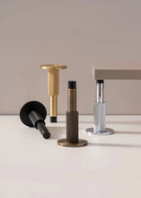 Load image into Gallery viewer, INSPIRA LIFESTYLES - Knurled Wall Door Stops with crisscross diamond-pattern detailing, adjustable length and rubber cushion pads in Matte Black, Satin Brass, Bright Chrome and Antique Bronze.
