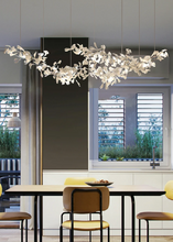 Load image into Gallery viewer, INSPIRA LIFESTYLES - Sculptural Leaf Chandelier, porcelain ginkgo chandelier, cascading porcelain leaf light, gold canopy chandelier, modern statement ceiling light, dining room chandelier, kitchen island pendant light, living room accent lighting, stairwell chandelier, contemporary sculptural light fixture, minimalist gold chandelier, transitional interior lighting, luxury porcelain chandelier, designer lighting fixture
