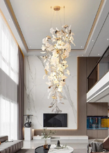 Load image into Gallery viewer, INSPIRA LIFESTYLES - Sculptural Leaf Chandelier, porcelain ginkgo chandelier, cascading porcelain leaf light, gold canopy chandelier, modern statement ceiling light, dining room chandelier, kitchen island pendant light, living room accent lighting, stairwell chandelier, contemporary sculptural light fixture, minimalist gold chandelier, transitional interior lighting, luxury porcelain chandelier, designer lighting fixture
