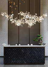 Load image into Gallery viewer, INSPIRA LIFESTYLES - Sculptural Leaf Chandelier, porcelain ginkgo chandelier, cascading porcelain leaf light, gold canopy chandelier, modern statement ceiling light, dining room chandelier, kitchen island pendant light, living room accent lighting, stairwell chandelier, contemporary sculptural light fixture, minimalist gold chandelier, transitional interior lighting, luxury porcelain chandelier, designer lighting fixture
