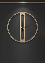 Load image into Gallery viewer, INSPIRA LIFESTYLES - Xavier Wall Clock, extra large wall clock, modern iron wall clock, sculptural wall decor, gold wall clock, charcoal wall clock, minimalist timepiece, statement wall accent, living room clock, office wall clock, oversized modern clock Modern wall clock with a geometric design on a dark background

