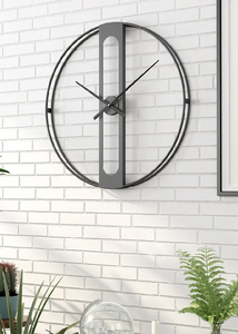 INSPIRA LIFESTYLES - Xavier Wall Clock, extra large wall clock, modern iron wall clock, sculptural wall decor, gold wall clock, charcoal wall clock, minimalist timepiece, statement wall accent, living room clock, office wall clock, oversized modern clock Modern wall clock on a white brick wall with plants around
