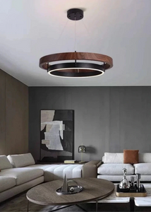 INSPIRA LIFESTYLES – Anello Duo Chandelier – sculptural two-tier chandelier with wood-patterned ring and matte black ring. Modern LED light fixture for dining rooms, living rooms, stairwells, offices, and transitional interiors.
