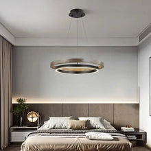 Load image into Gallery viewer, INSPIRA LIFESTYLES – Anello Duo Chandelier – sculptural two-tier chandelier with wood-patterned ring and matte black ring. Modern LED light fixture for dining rooms, living rooms, stairwells, offices, and transitional interiors.
