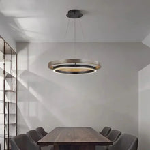 Load image into Gallery viewer, INSPIRA LIFESTYLES – Anello Duo Chandelier – sculptural two-tier chandelier with wood-patterned ring and matte black ring. Modern LED light fixture for dining rooms, living rooms, stairwells, offices, and transitional interiors.
