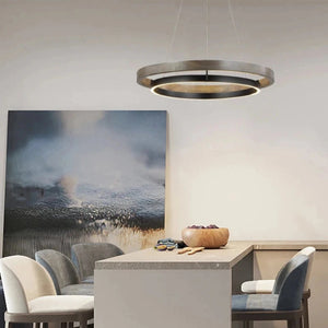 INSPIRA LIFESTYLES – Anello Duo Chandelier – sculptural two-tier chandelier with wood-patterned ring and matte black ring. Modern LED light fixture for dining rooms, living rooms, stairwells, offices, and transitional interiors.