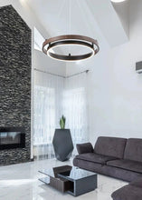 Load image into Gallery viewer, INSPIRA LIFESTYLES – Anello Duo Chandelier – sculptural two-tier chandelier with wood-patterned ring and matte black ring. Modern LED light fixture for dining rooms, living rooms, stairwells, offices, and transitional interiors.
