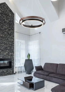 INSPIRA LIFESTYLES – Anello Duo Chandelier – sculptural two-tier chandelier with wood-patterned ring and matte black ring. Modern LED light fixture for dining rooms, living rooms, stairwells, offices, and transitional interiors.