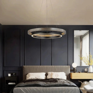 INSPIRA LIFESTYLES – Anello Duo Chandelier – sculptural two-tier chandelier with wood-patterned ring and matte black ring. Modern LED light fixture for dining rooms, living rooms, stairwells, offices, and transitional interiors.