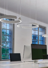 Load image into Gallery viewer, INSPIRA LIFESTYLES – Cuff Circular Pendant, modern ring chandelier in rose gold, gold, black, and white, minimalist circular LED pendant light for dining rooms, conference rooms, double-height spaces, and contemporary interiors
