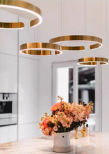 Load image into Gallery viewer, INSPIRA LIFESTYLES – Cuff Circular Pendant, modern ring chandelier in rose gold, gold, black, and white, minimalist circular LED pendant light for dining rooms, conference rooms, double-height spaces, and contemporary interiors
