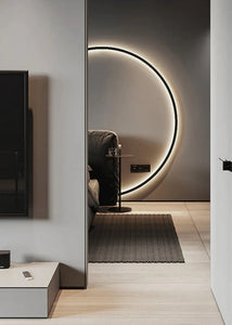 INSPIRA LIFESTYLES – Minimalist Metal Ring Light, a modern circular LED wall light with sleek sculptural design. This versatile wall sconce doubles as accent lighting and wall art, perfect as a bedroom light above a headboard, a living room statement piece, or a minimalist hallway fixture. Contemporary ring light crafted in metal with soft LED illumination, ideal for modern interiors seeking sculptural lighting, circle lights, or functional yet artistic wall sconces.