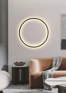 INSPIRA LIFESTYLES – Minimalist Metal Ring Light, a modern circular LED wall light with sleek sculptural design. This versatile wall sconce doubles as accent lighting and wall art, perfect as a bedroom light above a headboard, a living room statement piece, or a minimalist hallway fixture. Contemporary ring light crafted in metal with soft LED illumination, ideal for modern interiors seeking sculptural lighting, circle lights, or functional yet artistic wall sconces.