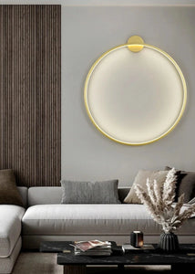 INSPIRA LIFESTYLES – Minimalist Metal Ring Light, a modern circular LED wall light with sleek sculptural design. This versatile wall sconce doubles as accent lighting and wall art, perfect as a bedroom light above a headboard, a living room statement piece, or a minimalist hallway fixture. Contemporary ring light crafted in metal with soft LED illumination, ideal for modern interiors seeking sculptural lighting, circle lights, or functional yet artistic wall sconces.