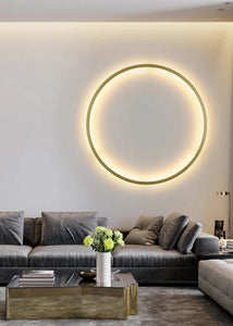 INSPIRA LIFESTYLES – Minimalist Metal Ring Light, a modern circular LED wall light with sleek sculptural design. This versatile wall sconce doubles as accent lighting and wall art, perfect as a bedroom light above a headboard, a living room statement piece, or a minimalist hallway fixture. Contemporary ring light crafted in metal with soft LED illumination, ideal for modern interiors seeking sculptural lighting, circle lights, or functional yet artistic wall sconces.