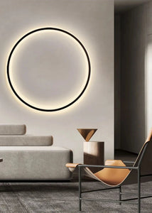 INSPIRA LIFESTYLES – Minimalist Metal Ring Light, a modern circular LED wall light with sleek sculptural design. This versatile wall sconce doubles as accent lighting and wall art, perfect as a bedroom light above a headboard, a living room statement piece, or a minimalist hallway fixture. Contemporary ring light crafted in metal with soft LED illumination, ideal for modern interiors seeking sculptural lighting, circle lights, or functional yet artistic wall sconces.