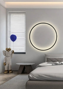 INSPIRA LIFESTYLES – Minimalist Metal Ring Light, a modern circular LED wall light with sleek sculptural design. This versatile wall sconce doubles as accent lighting and wall art, perfect as a bedroom light above a headboard, a living room statement piece, or a minimalist hallway fixture. Contemporary ring light crafted in metal with soft LED illumination, ideal for modern interiors seeking sculptural lighting, circle lights, or functional yet artistic wall sconces.
