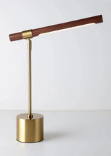 Load image into Gallery viewer, INSPIRA LIFESTYLES – Postaro Table Lamp – modern LED table lamp with postmodern design, featuring a dark wood base and satin brass accents. Sculptural yet functional lighting with a 90-degree adjustable tilt, perfect for bedside tables, home offices, and contemporary workspaces.
