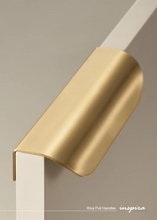 Load image into Gallery viewer, INSPIRA LIFESTYLES - RIVA PULL HANDLES, EDGE PULL HANDLES, SOLID BRASS CABINET HANDLE, MODERN ARC HANDLE, ERGONOMIC CABINET PULL, MINIMAL CABINET HARDWARE, BUILT IN EDGE PULL, KITCHEN DRAWER EDGE HANDLE, ANTIQUE BRONZE CABINET HANDLE, BRUSHED GOLD EDGE PULL, BLACK CABINET HARDWARE, WHITE CABINET HANDLE, ARCHITECTURAL CABINET HARDWARE, CONTEMPORARY MILLWORK HARDWARE, INSPIRA LIFESTYLES
