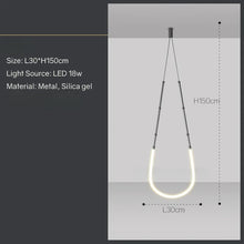 Load image into Gallery viewer, Siliq Sculptural Light with handcrafted silicone forms and metallic segmented cables, single minimalist pendant with glowing silicone tube, dramatic chandelier version of Siliq Light for high ceilings, floor-to-ceiling sculptural lighting installation in modern interior, flexible silicone light tubes emitting soft ambient glow, artistic designer light fixture styled in dining room, contemporary sculptural lighting as statement piece in commercial space.
