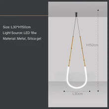 Load image into Gallery viewer, Siliq Sculptural Light with handcrafted silicone forms and metallic segmented cables, single minimalist pendant with glowing silicone tube, dramatic chandelier version of Siliq Light for high ceilings, floor-to-ceiling sculptural lighting installation in modern interior, flexible silicone light tubes emitting soft ambient glow, artistic designer light fixture styled in dining room, contemporary sculptural lighting as statement piece in commercial space.
