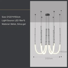 Load image into Gallery viewer, Siliq Sculptural Light with handcrafted silicone forms and metallic segmented cables, single minimalist pendant with glowing silicone tube, dramatic chandelier version of Siliq Light for high ceilings, floor-to-ceiling sculptural lighting installation in modern interior, flexible silicone light tubes emitting soft ambient glow, artistic designer light fixture styled in dining room, contemporary sculptural lighting as statement piece in commercial space.
