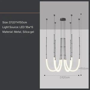 Siliq Sculptural Light with handcrafted silicone forms and metallic segmented cables, single minimalist pendant with glowing silicone tube, dramatic chandelier version of Siliq Light for high ceilings, floor-to-ceiling sculptural lighting installation in modern interior, flexible silicone light tubes emitting soft ambient glow, artistic designer light fixture styled in dining room, contemporary sculptural lighting as statement piece in commercial space.