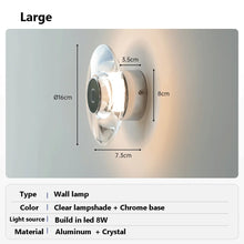 Load image into Gallery viewer, Inspira Lifestyles | Onda Crystal Wall Light with round optical crystal disc and chrome center, mounted as a modern LED wall or ceiling sconce.

