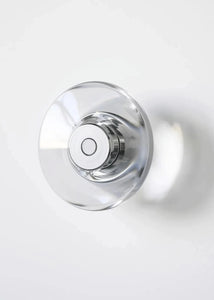 Inspira Lifestyles | Onda Crystal Wall Light with round optical crystal disc and chrome center, mounted as a modern LED wall or ceiling sconce.
