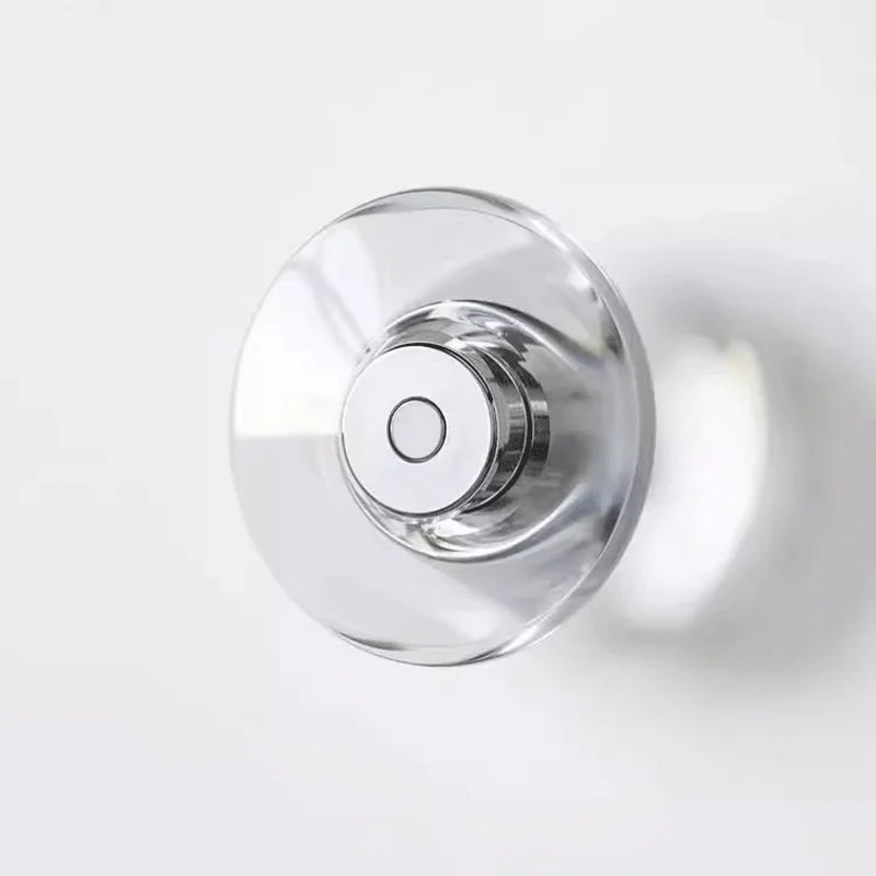 Inspira Lifestyles | Onda Crystal Wall Light with round optical crystal disc and chrome center, mounted as a modern LED wall or ceiling sconce.