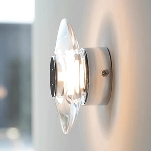 Inspira Lifestyles | Onda Crystal Wall Light with round optical crystal disc and chrome center, mounted as a modern LED wall or ceiling sconce.