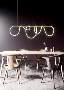 INSPIRA LIFESTYLES | Linear Rope Chandelier - Modern dining area with a unique pendant light fixture.