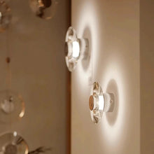 Load image into Gallery viewer, Inspira Lifestyles | Onda Crystal Wall Light with round optical crystal disc and chrome center, mounted as a modern LED wall or ceiling sconce.
