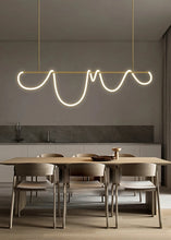 Load image into Gallery viewer, INSPIRA LIFESTYLES | Linear Rope Chandelier - Modern dining area with a unique pendant light fixture.
