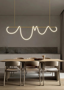INSPIRA LIFESTYLES | Linear Rope Chandelier - Modern dining area with a unique pendant light fixture.