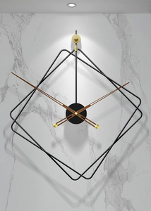 Oversized Thierry Wall Clock with minimalist iron frame and wooden arms, sculptural geometric wall clock as statement decor, modern wall clock styled in living room, large decorative wall clock in entryway, close-up of wooden hands on Thierry Wall Clock, contemporary geometric clock on neutral wall. Modern wall clock with gold accents on a marble wall