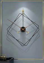 Load image into Gallery viewer, Oversized Thierry Wall Clock with minimalist iron frame and wooden arms, sculptural geometric wall clock as statement decor, modern wall clock styled in living room, large decorative wall clock in entryway, close-up of wooden hands on Thierry Wall Clock, contemporary geometric clock on neutral wall. Modern wall clock with geometric design on a gray wall
