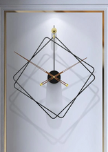 Load image into Gallery viewer, Oversized Thierry Wall Clock with minimalist iron frame and wooden arms, sculptural geometric wall clock as statement decor, modern wall clock styled in living room, large decorative wall clock in entryway, close-up of wooden hands on Thierry Wall Clock, contemporary geometric clock on neutral wall. Modern wall clock with geometric design on a light gray background
