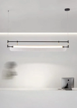 Load image into Gallery viewer, INSPIRA LIFESTYLES - Viso Linear Pendant, modern ribbed acrylic linear LED light, iron frame pendant lighting over kitchen island, dining table linear pendant, contemporary boardroom linear fixture
