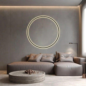INSPIRA LIFESTYLES – Minimalist Metal Ring Light, a modern circular LED wall light with sleek sculptural design. This versatile wall sconce doubles as accent lighting and wall art, perfect as a bedroom light above a headboard, a living room statement piece, or a minimalist hallway fixture. Contemporary ring light crafted in metal with soft LED illumination, ideal for modern interiors seeking sculptural lighting, circle lights, or functional yet artistic wall sconces.