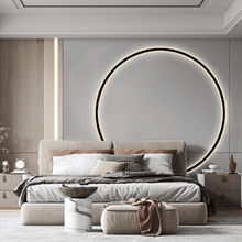 Load image into Gallery viewer, INSPIRA LIFESTYLES – Minimalist Metal Ring Light, a modern circular LED wall light with sleek sculptural design. This versatile wall sconce doubles as accent lighting and wall art, perfect as a bedroom light above a headboard, a living room statement piece, or a minimalist hallway fixture. Contemporary ring light crafted in metal with soft LED illumination, ideal for modern interiors seeking sculptural lighting, circle lights, or functional yet artistic wall sconces.
